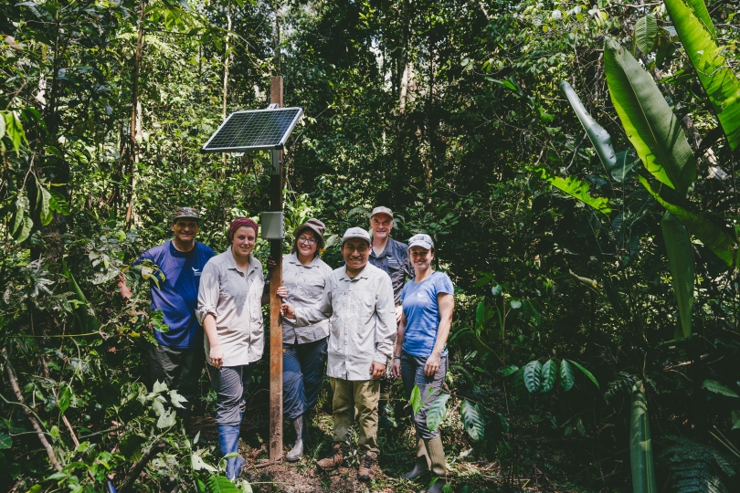 The team of Wilderness International with a sensor from Breeze Technologies in the Peru rainforest.